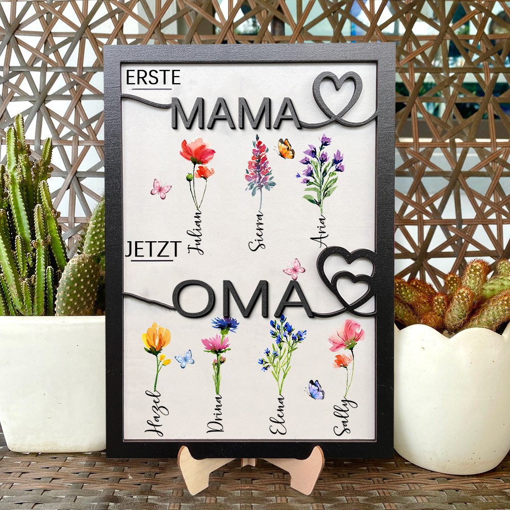 Personalisierter Holzrahmen mit dem Aufdruck „Erste Mama, jetzt Oma“ und Geburtsmonat-Blumen, mit den Namen der Kinder. Ein einzigartiges Geburtstagsgeschenk für Mama oder Oma und kreative Geschenkideen zum Muttertag.