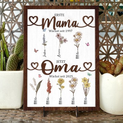 Personalisierter Holzrahmen mit dem Aufdruck „Erste Mama, jetzt Oma“ und Geburtsblumen, mit den Namen der Kinder. Ein einzigartiges Geburtstagsgeschenk für Mama oder Oma, ein Geschenk zur Babyparty und kreative Geschenkideen zum Muttertag.