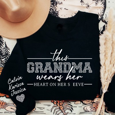 Custom This Grandma Wears Her Heart on Her Sleeve Sweatshirt with Grandkids Names on Sleeve Unique Mother's Day Gifts